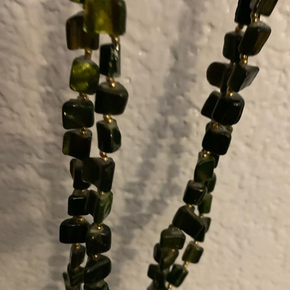 Double strand necklace using triangular green stones and golden spacers. 24” - Picture 1 of 2